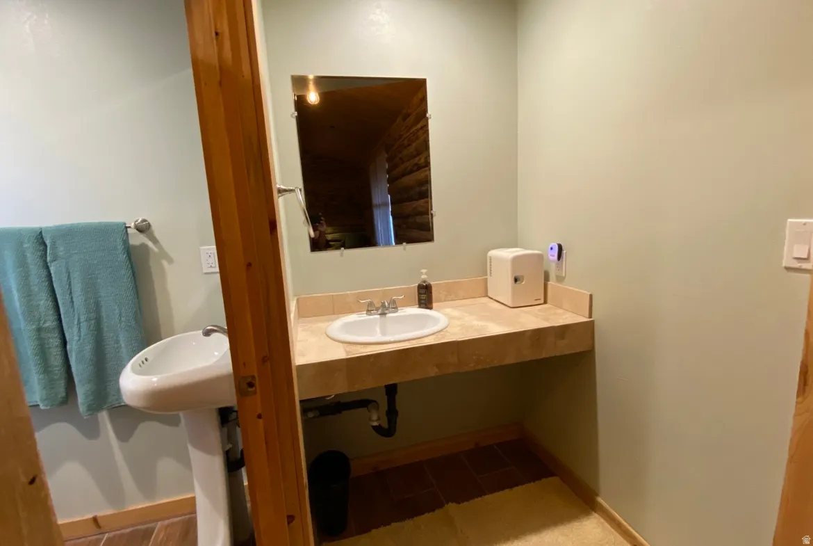 Bathroom featuring baseboards and vanity