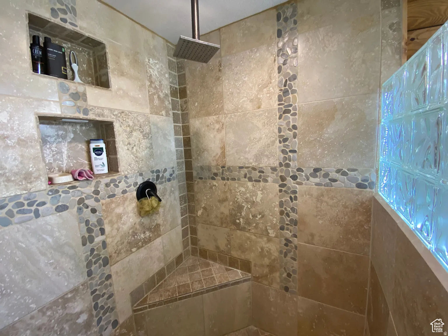 Full bath with a tile shower
