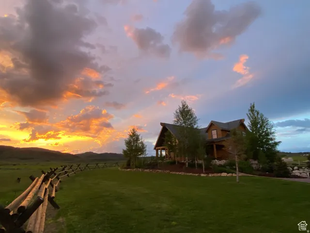 View of yard with a rural view and a mountain view