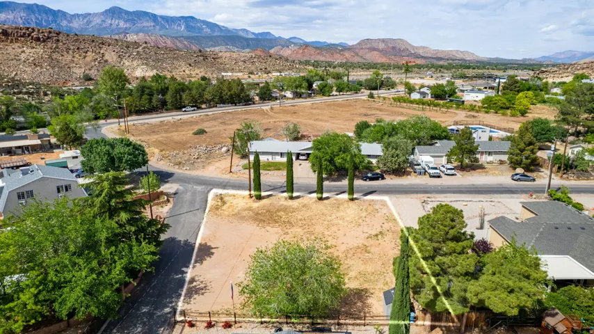 Aerial perspective of suburban area with a mountainous background