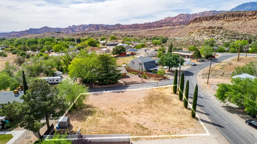 Aerial perspective of suburban area featuring a mountainous background