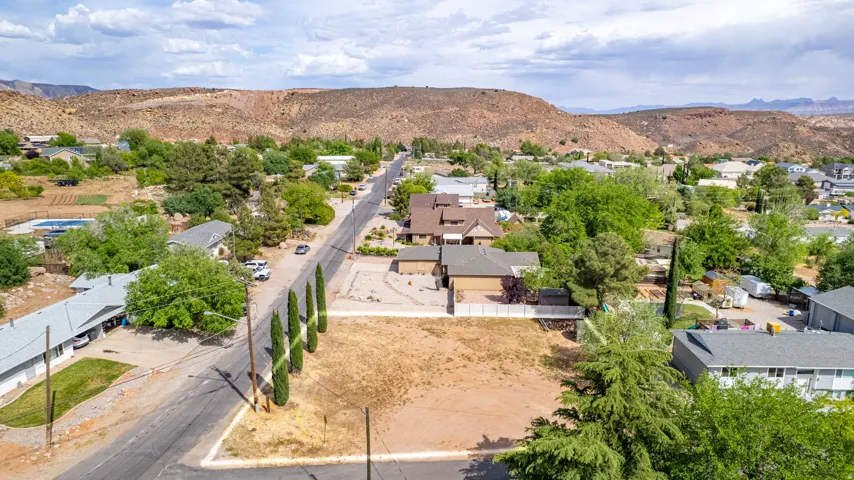 Aerial view of residential area featuring a mountain backdrop