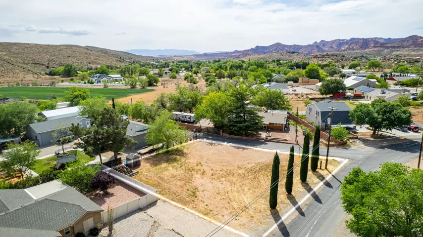 Aerial perspective of suburban area featuring a mountainous background