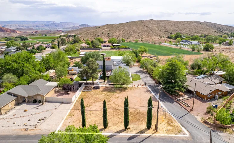 Aerial perspective of suburban area with a mountain backdrop