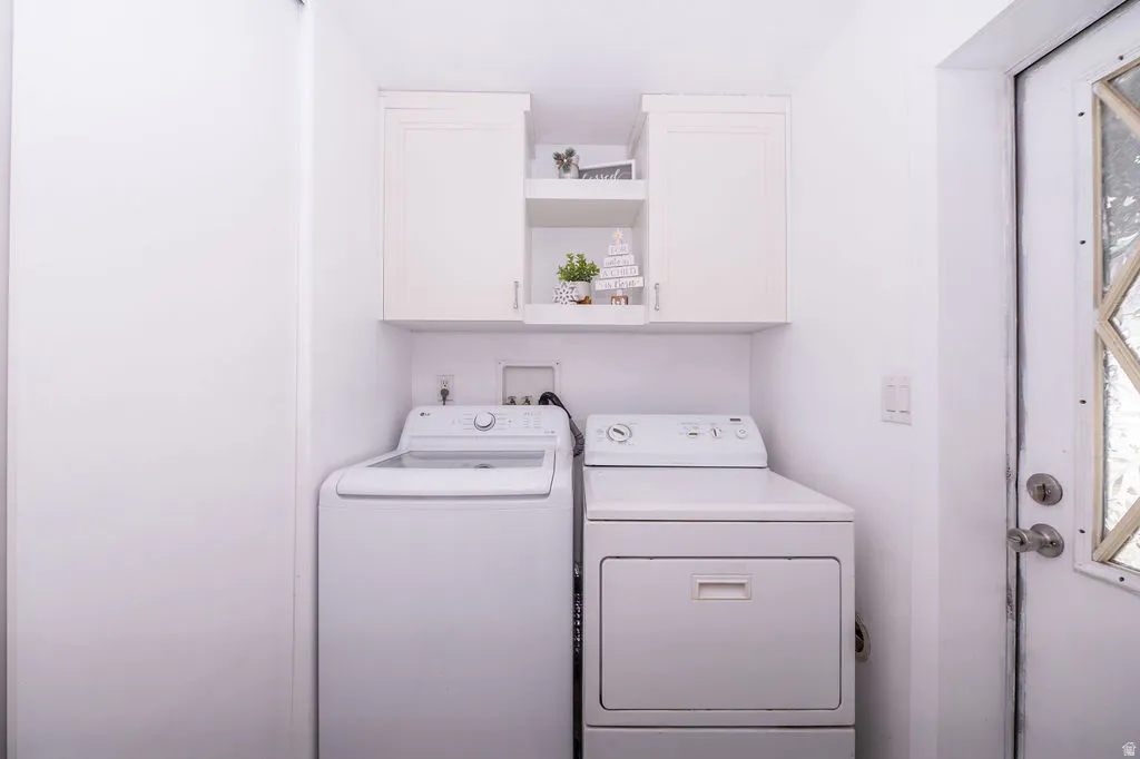 Laundry area with cabinet space and washer and dryer