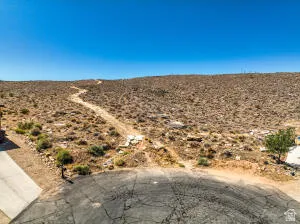 Aerial view of sparsely populated area featuring a desert landscape and mountains