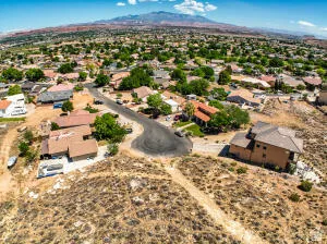 Aerial perspective of suburban area featuring a mountainous background