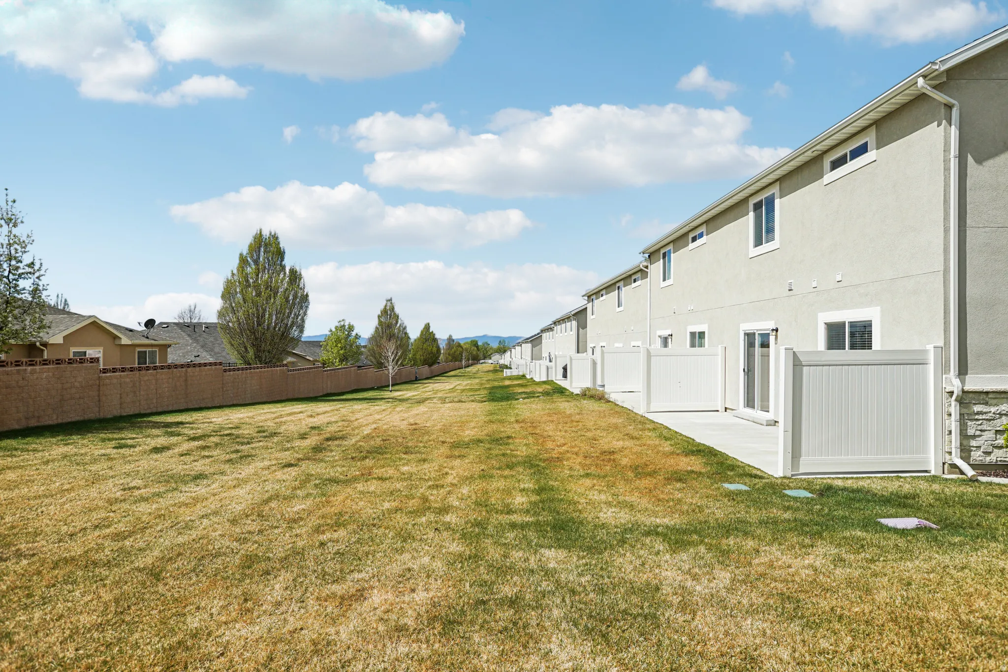 Fenced yard with a residential view