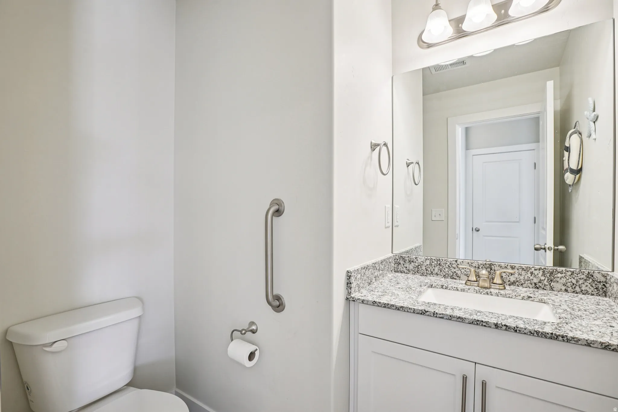 Bathroom with vanity and toilet