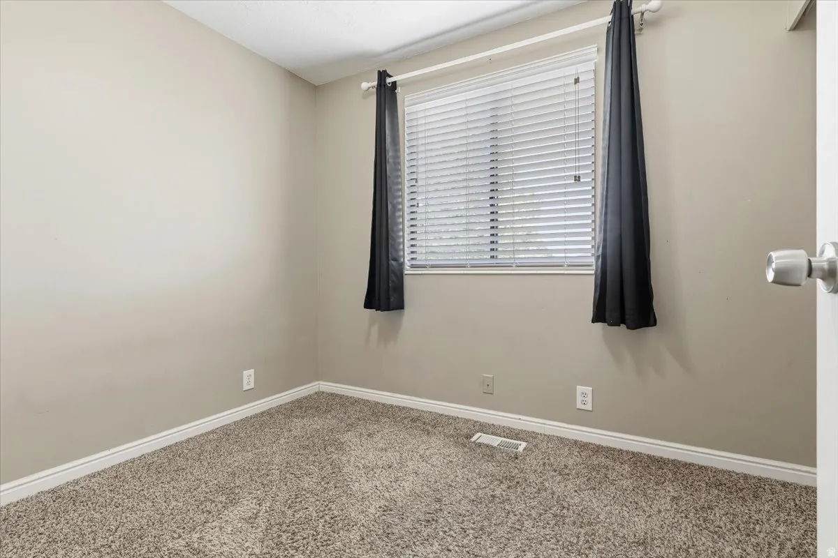 BedBroom with baseboards and carpet