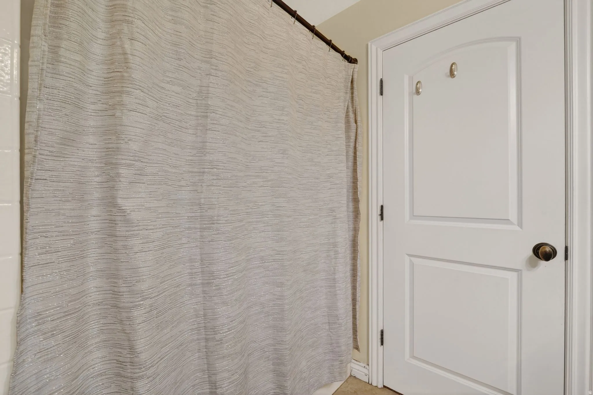 Bathroom featuring a shower with shower curtain