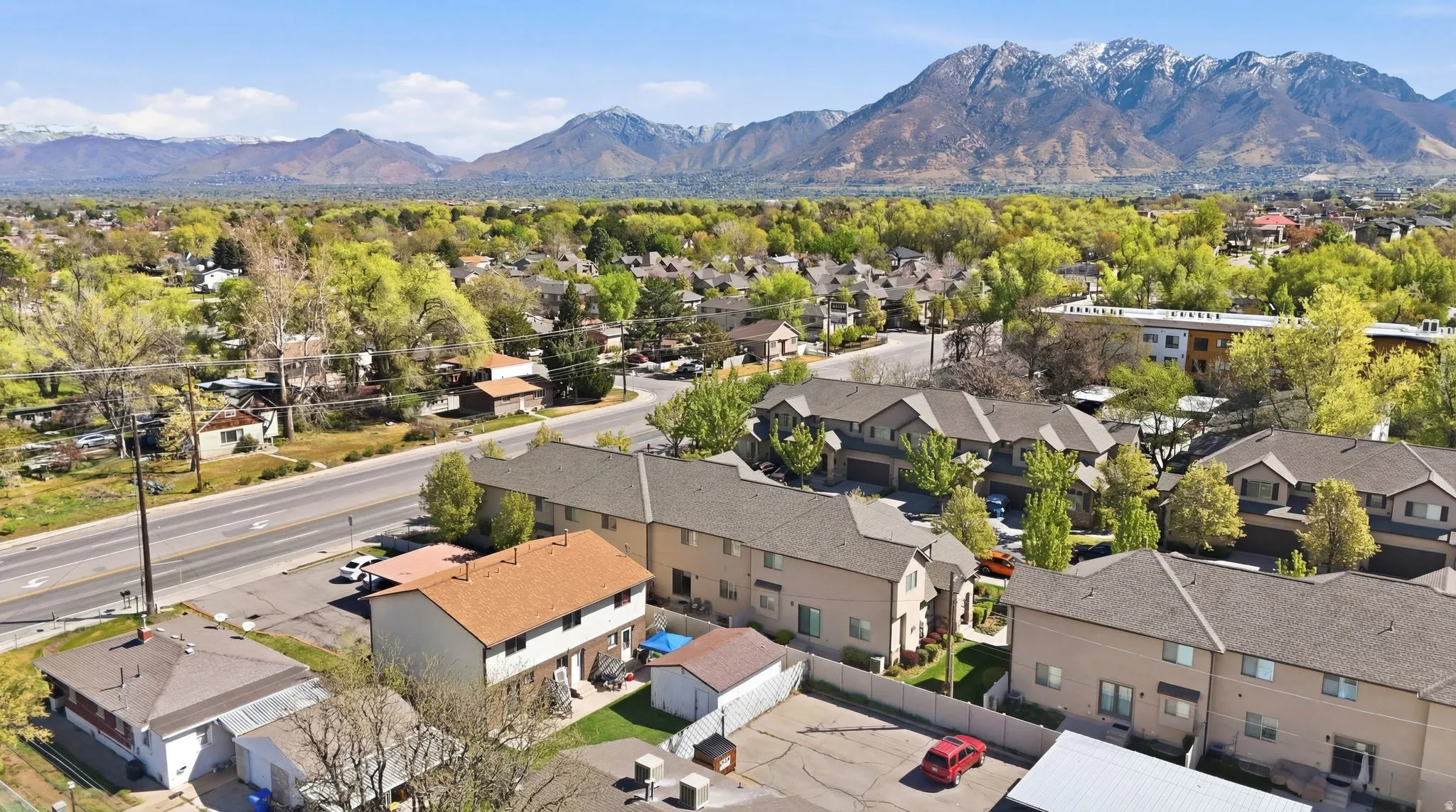 Aerial view of residential area with a mountainous background