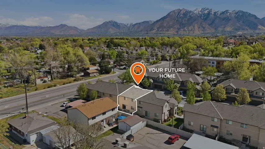 Aerial perspective of suburban area with a mountainous background