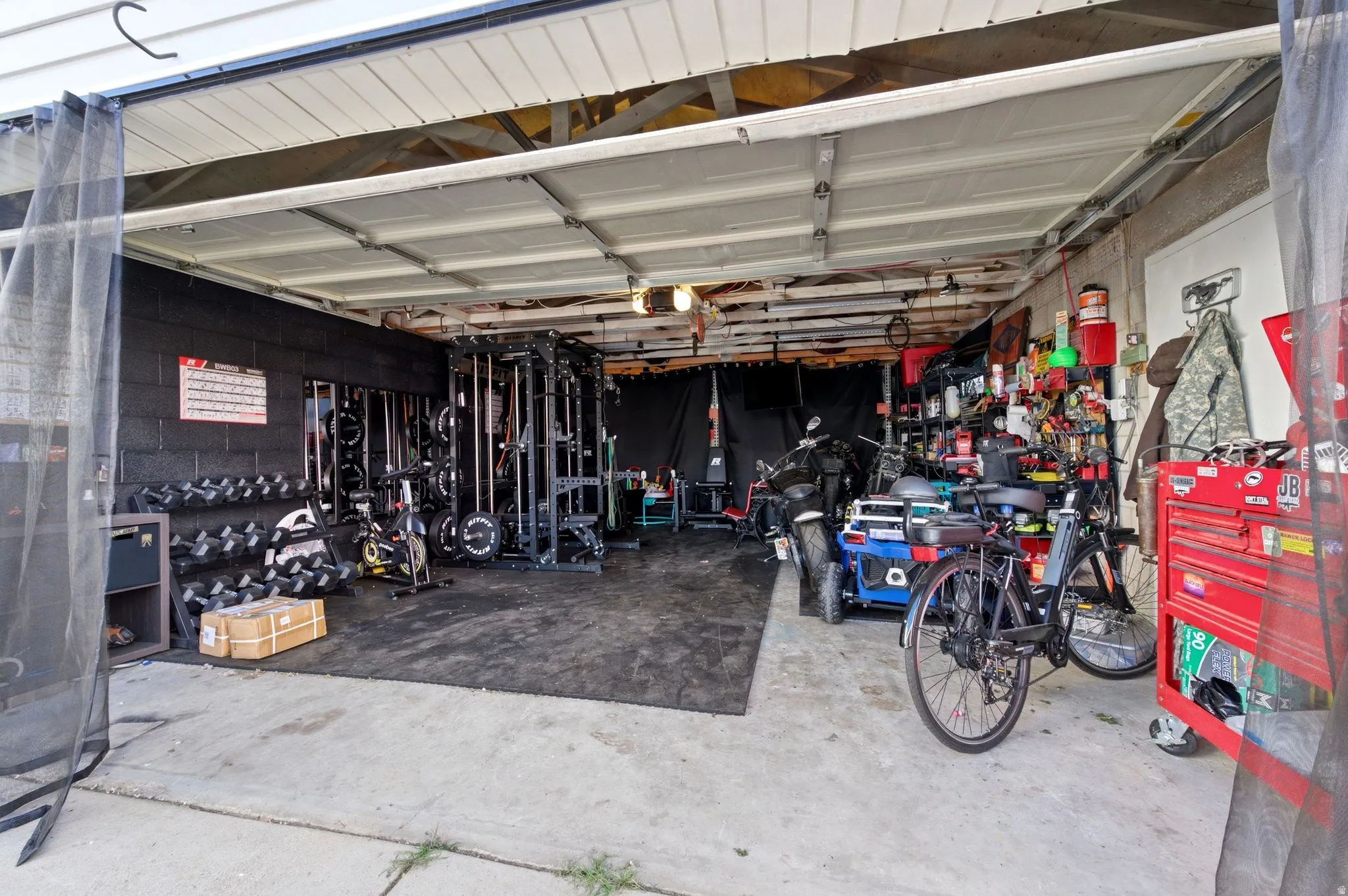 Garage featuring concrete block wall