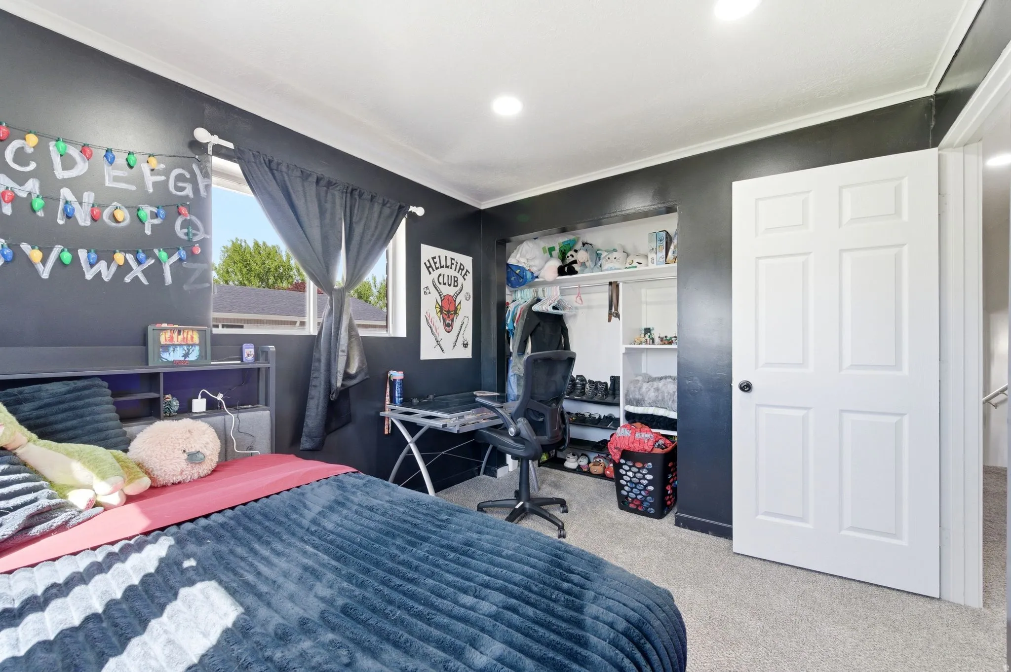 Bedroom featuring a closet and light carpet