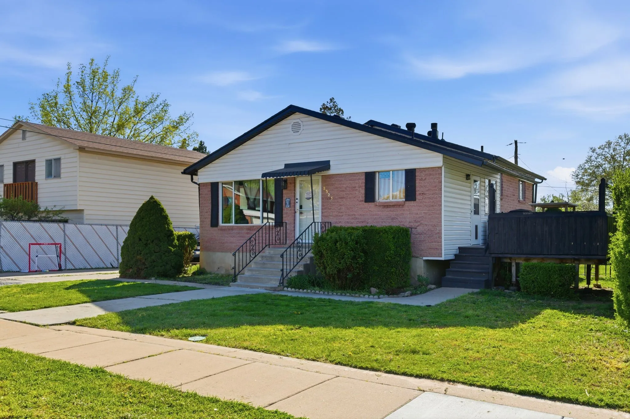 Bungalow-style home featuring a front lawn and brick siding
