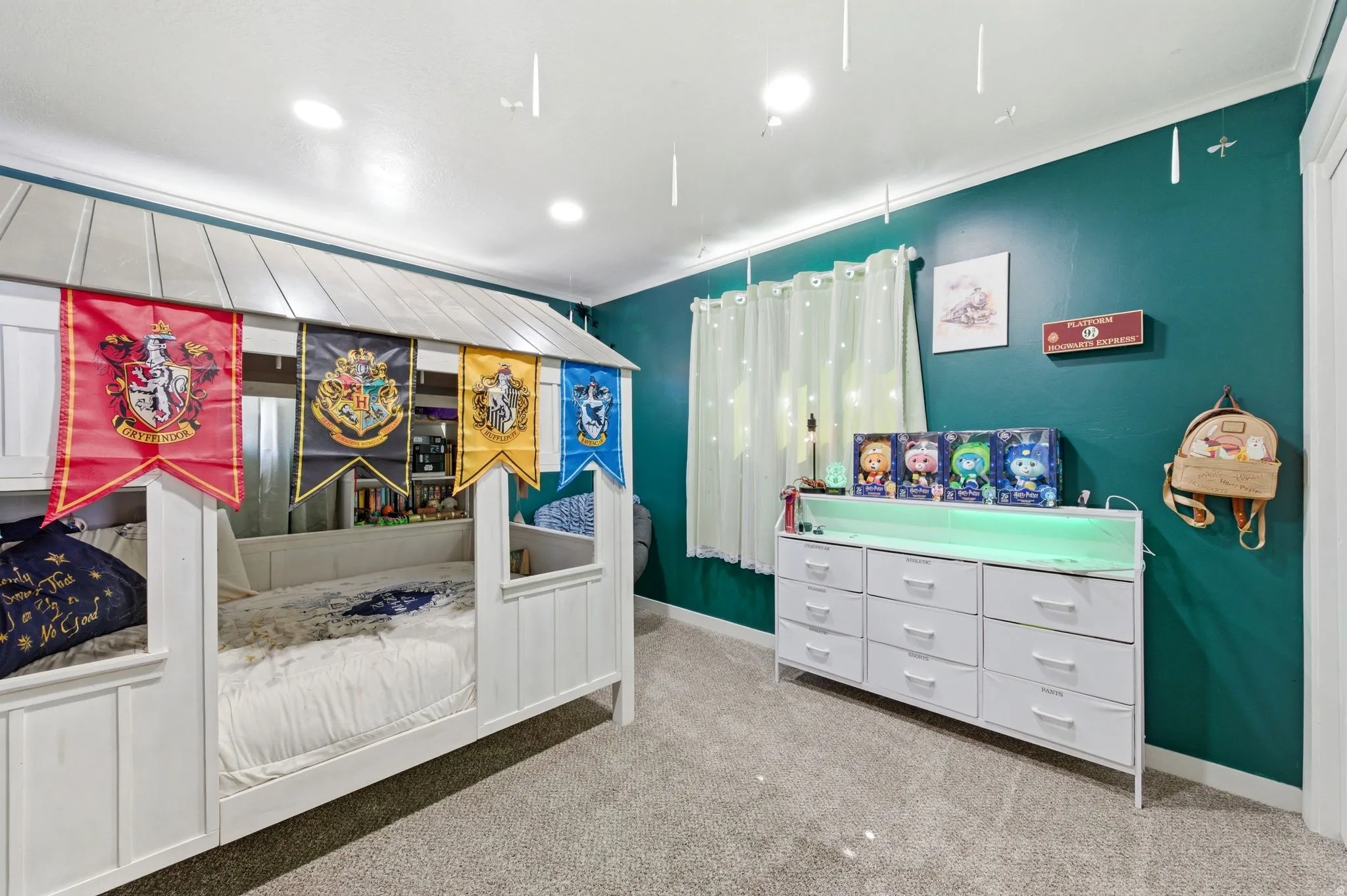 Carpeted bedroom with baseboards and recessed lighting