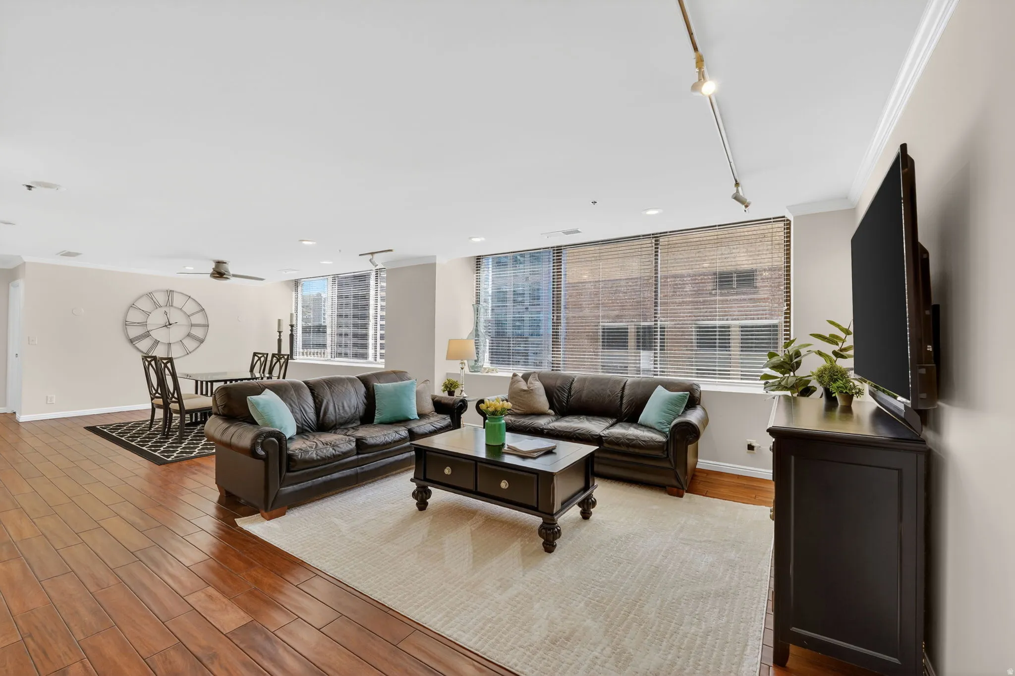 Living/formal dining area, East facing windows, natural light, hardwood flooring.