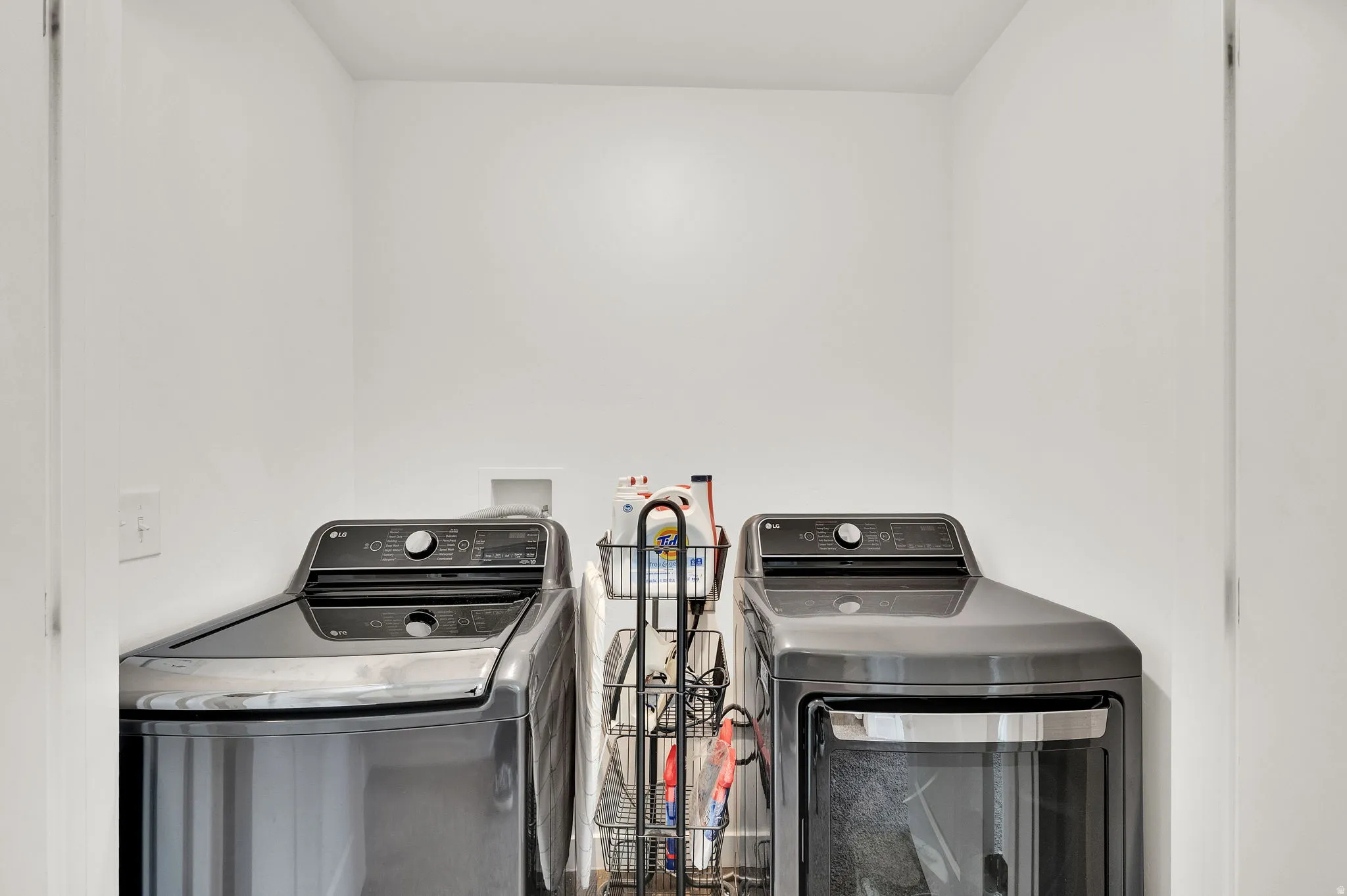 Laundry area with washing machine and clothes dryer