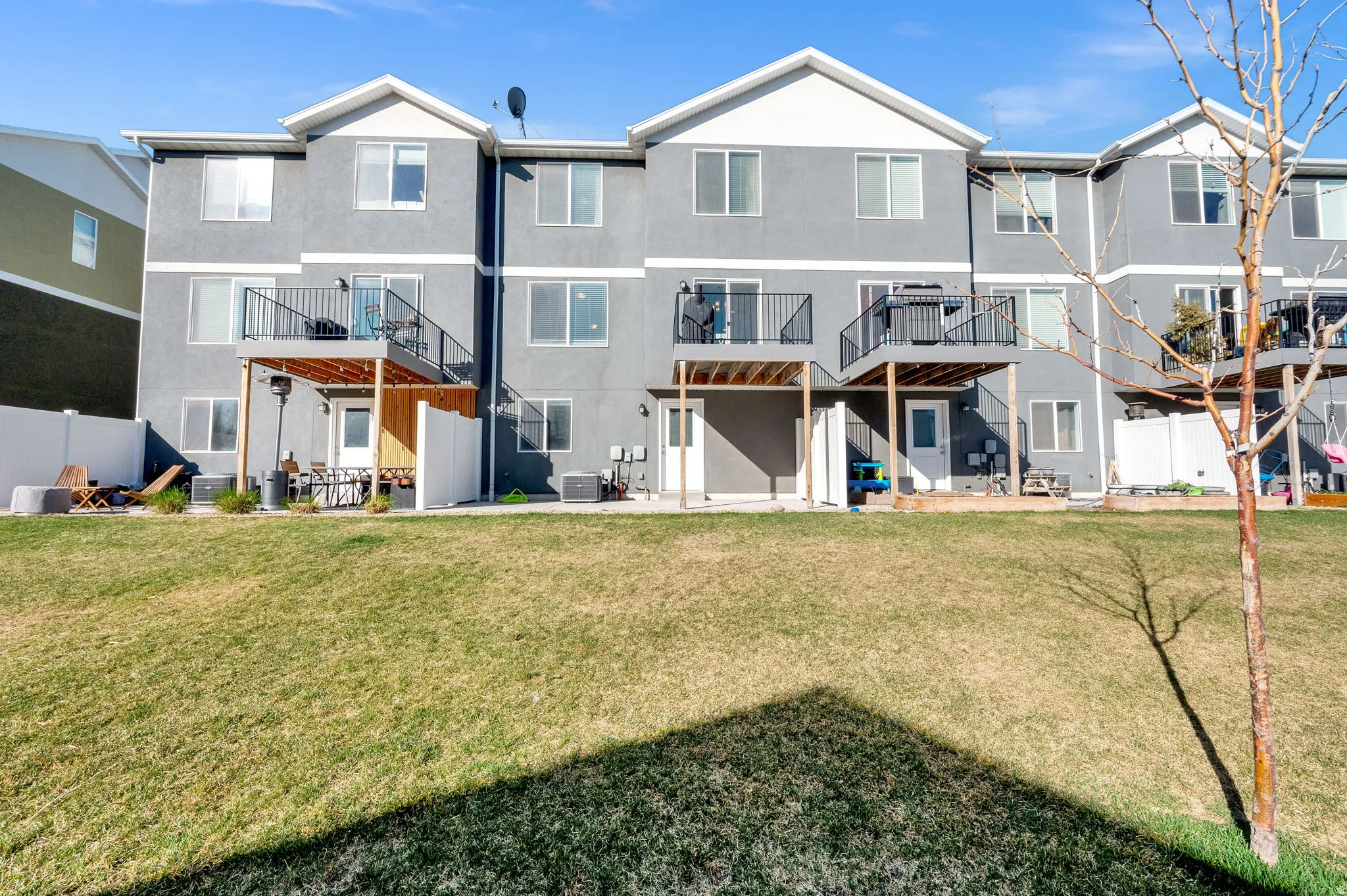 Back of house with a patio and stucco siding