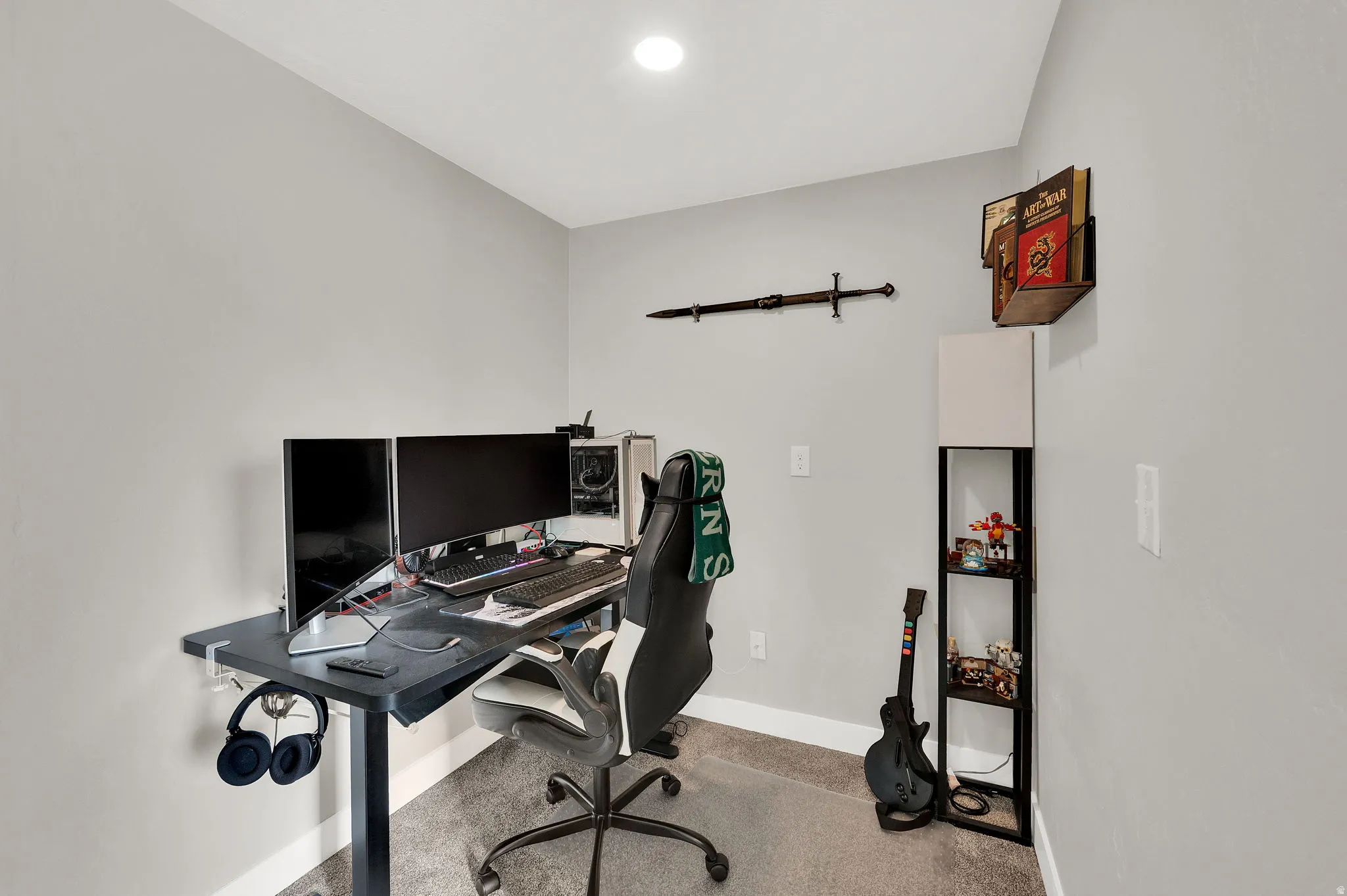 Office area with light colored carpet and recessed lighting