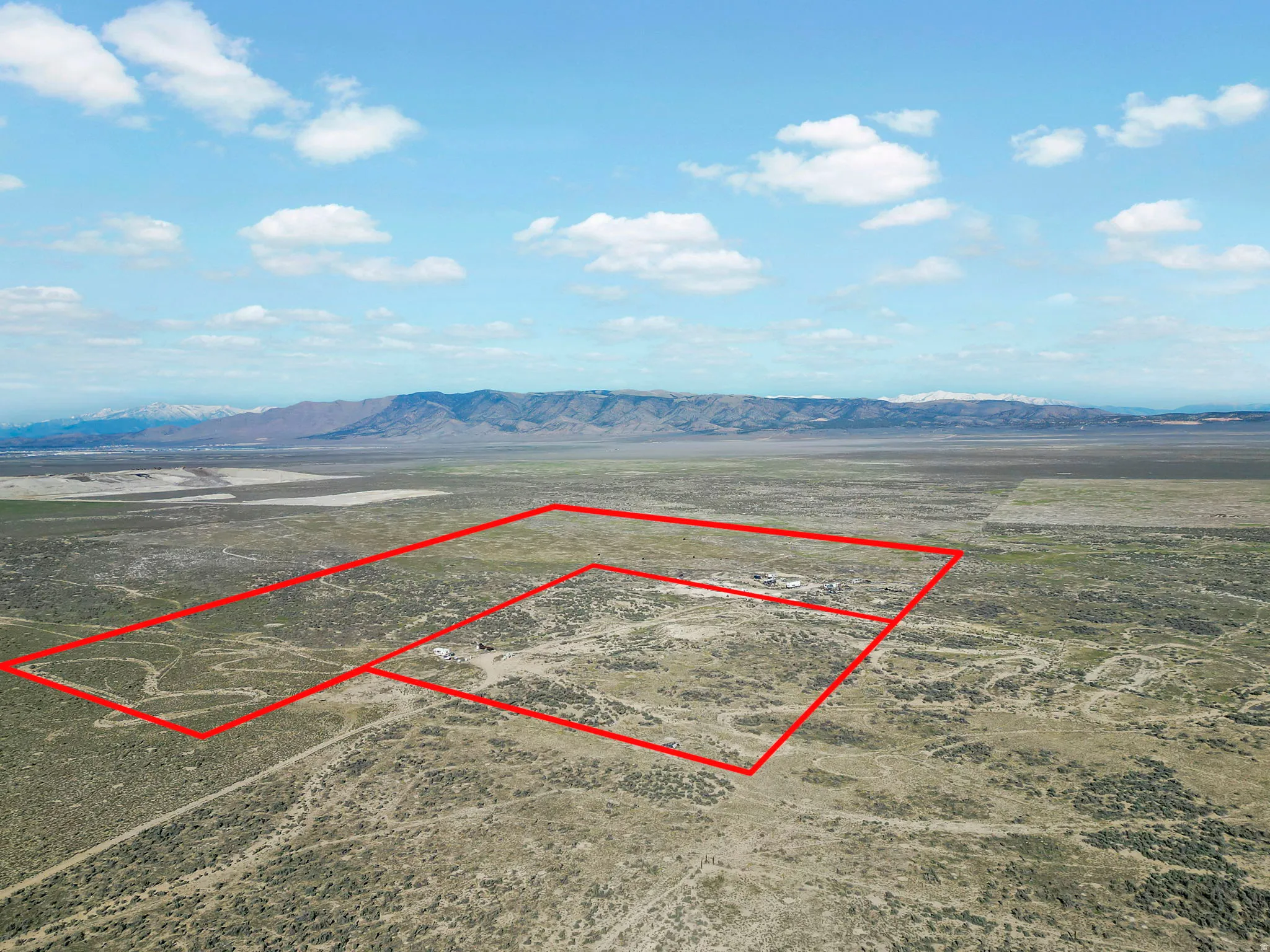 Expansive desert terrain with defined property lines