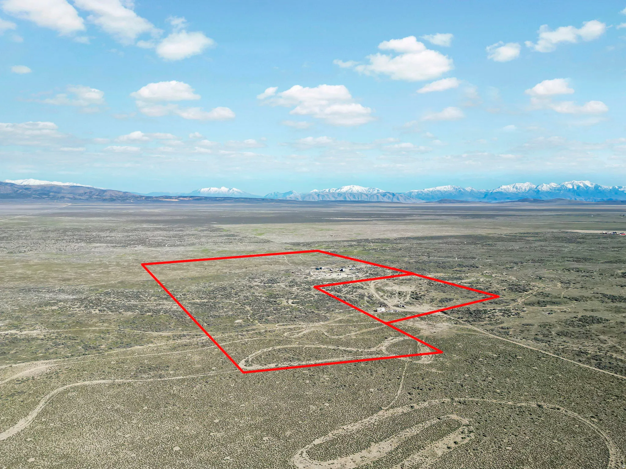 Expansive desert landscape with delineated property boundaries