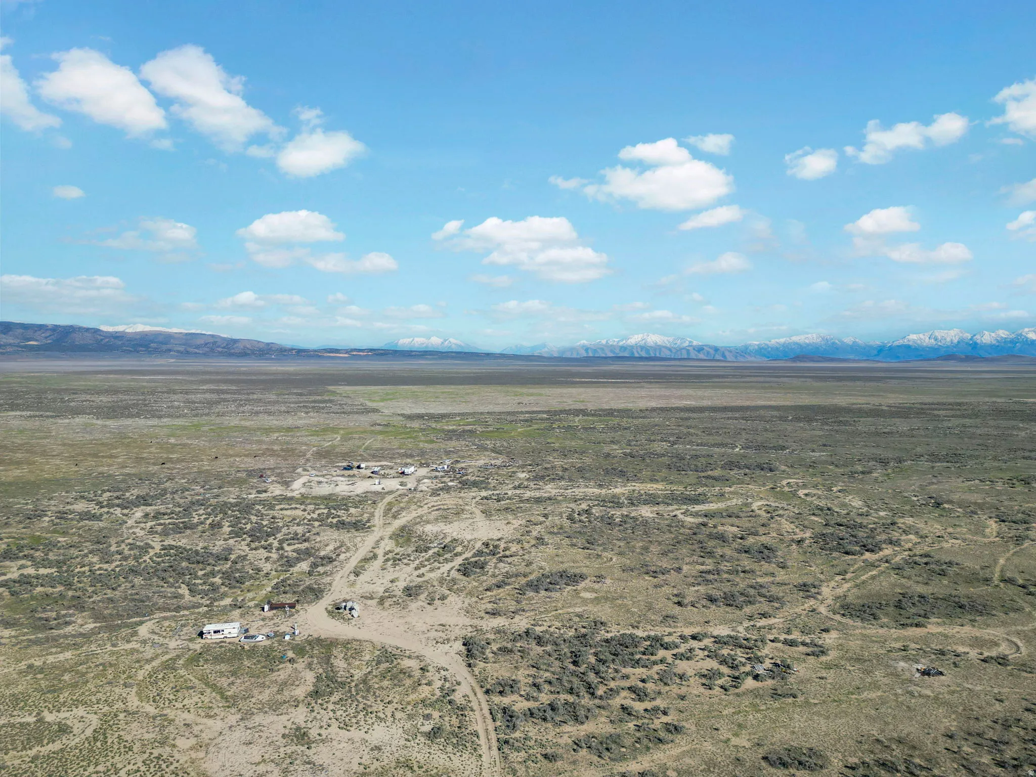 Expansive desert landscape with scattered green vegetation