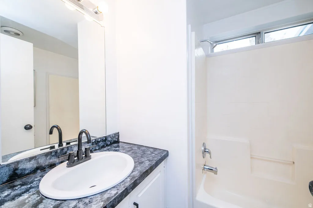 Full bath with vanity and  shower combination