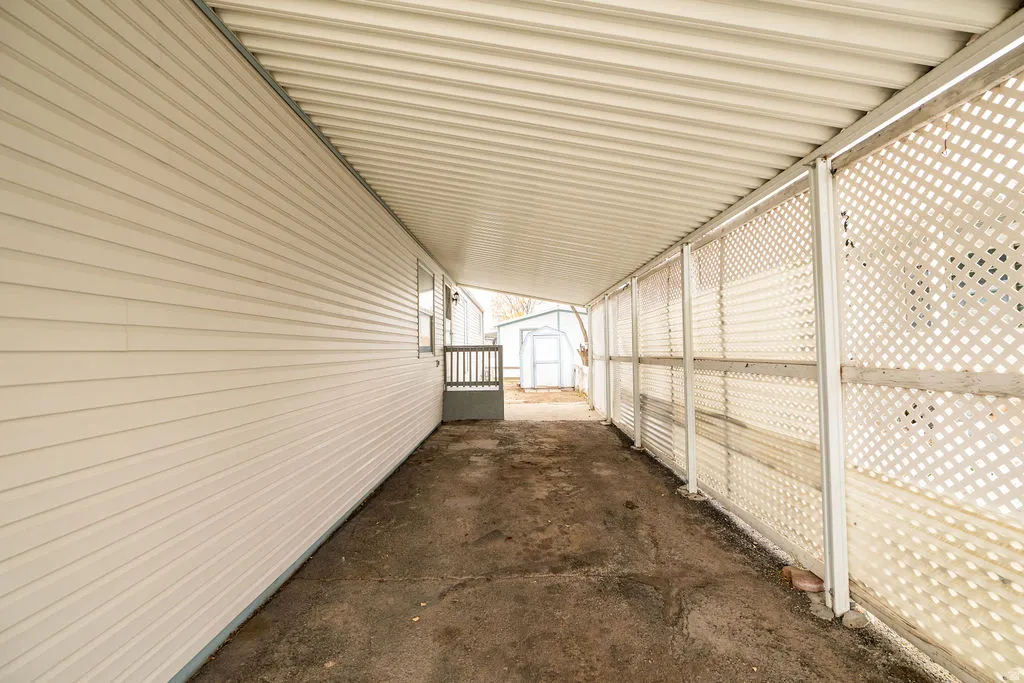 View of property exterior with a shed