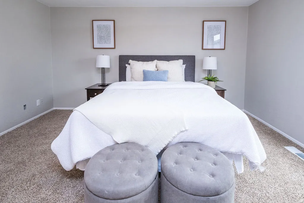 Carpeted bedroom featuring baseboards
