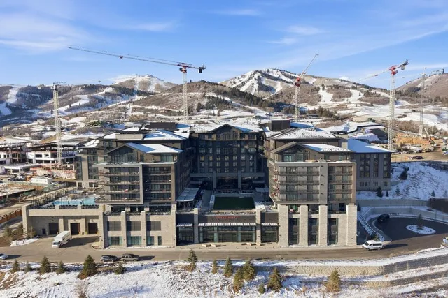 Snowy aerial view featuring a mountain view