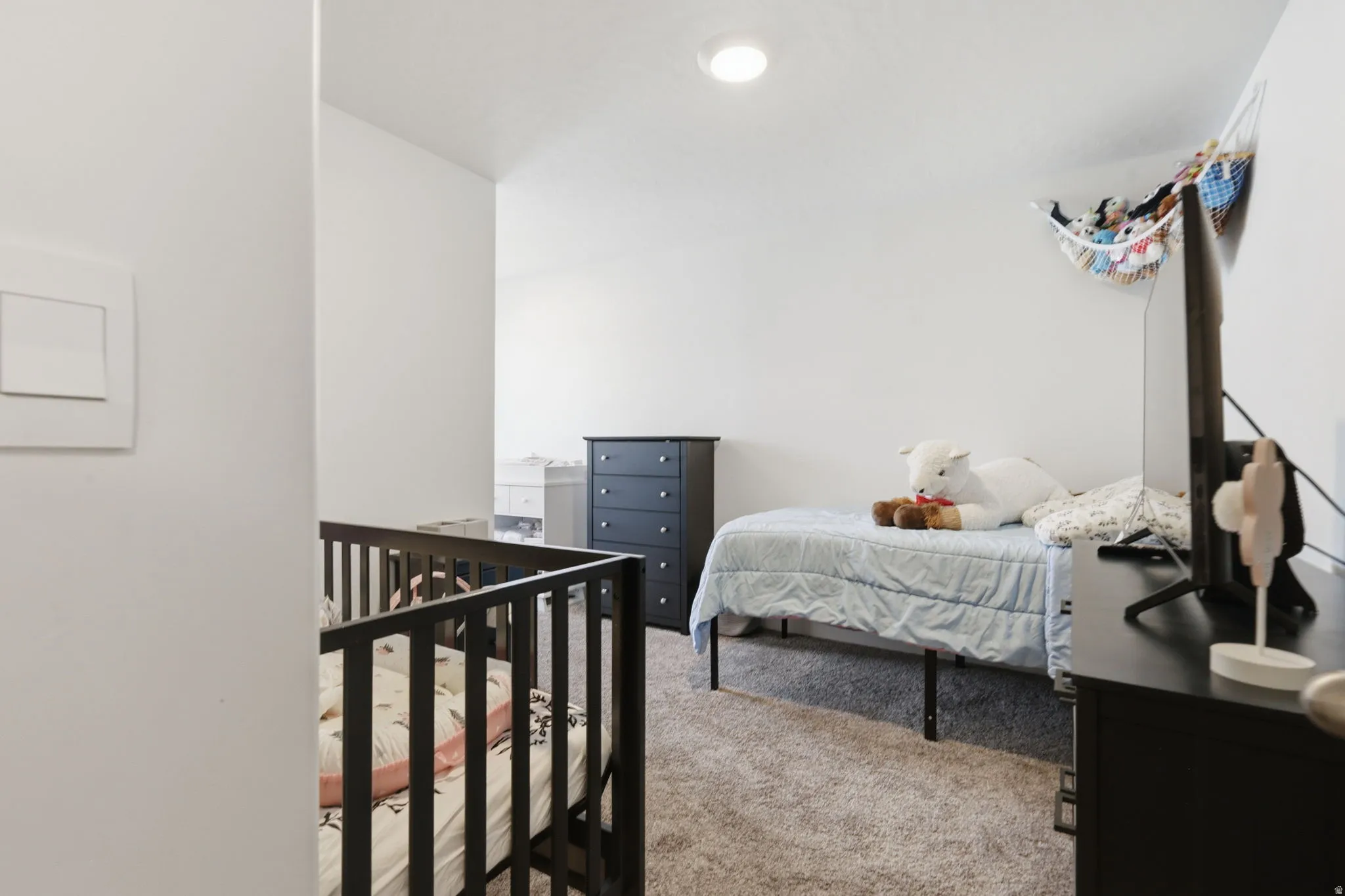 Bedroom with light carpet