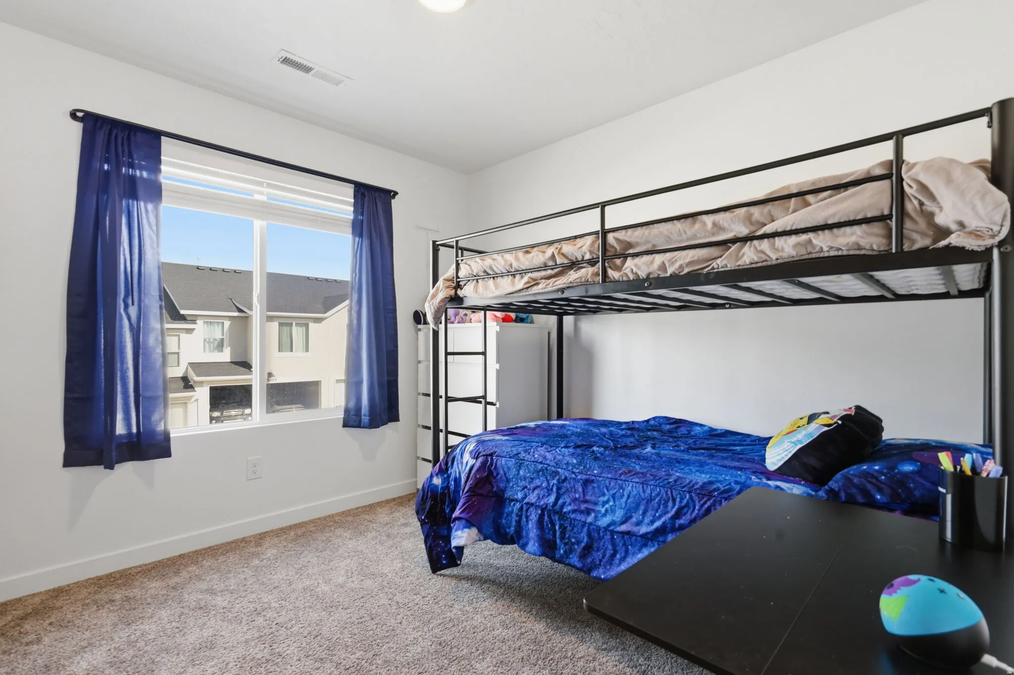 Bedroom with baseboards and carpet floors