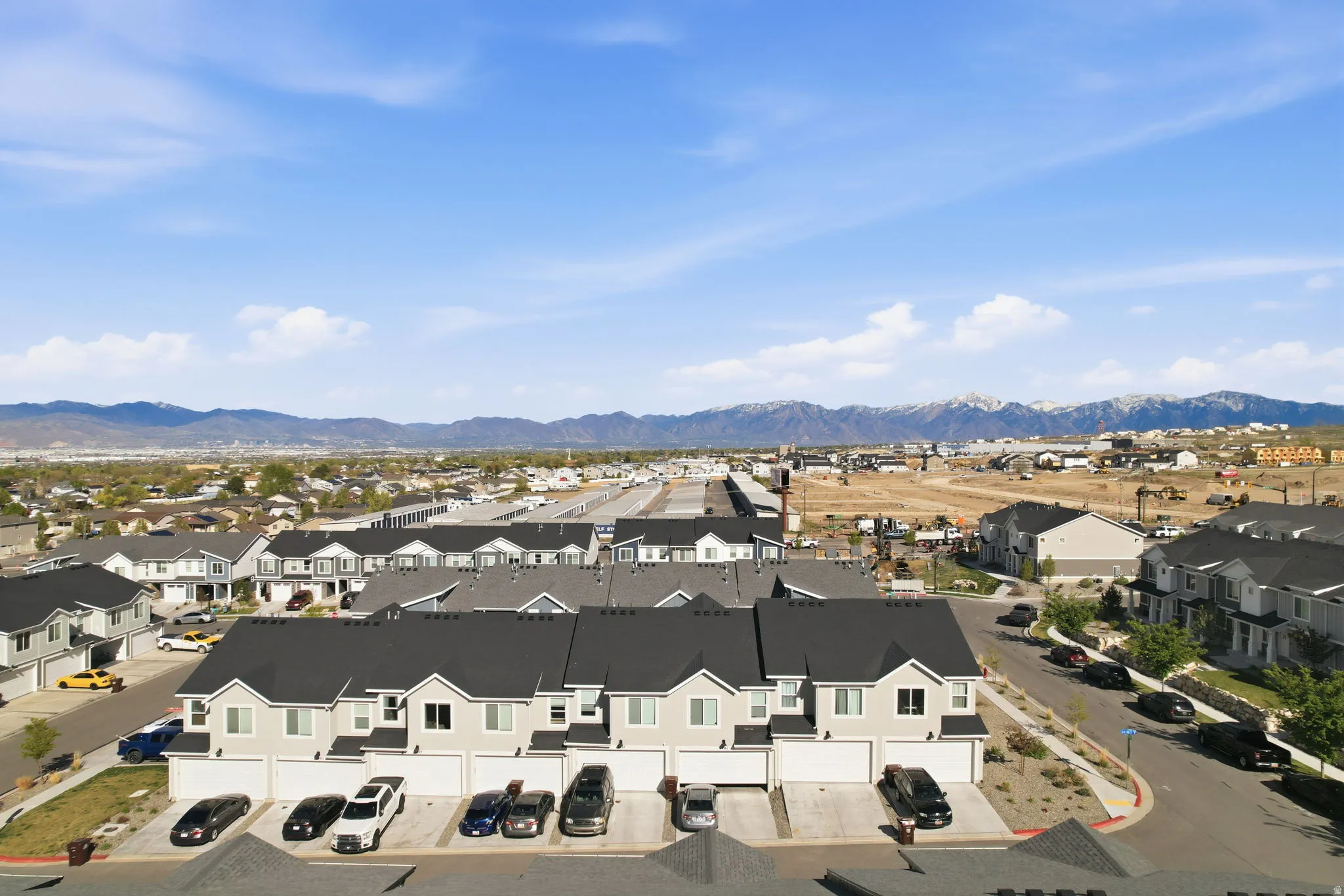 Aerial perspective of suburban area featuring a mountain backdrop
