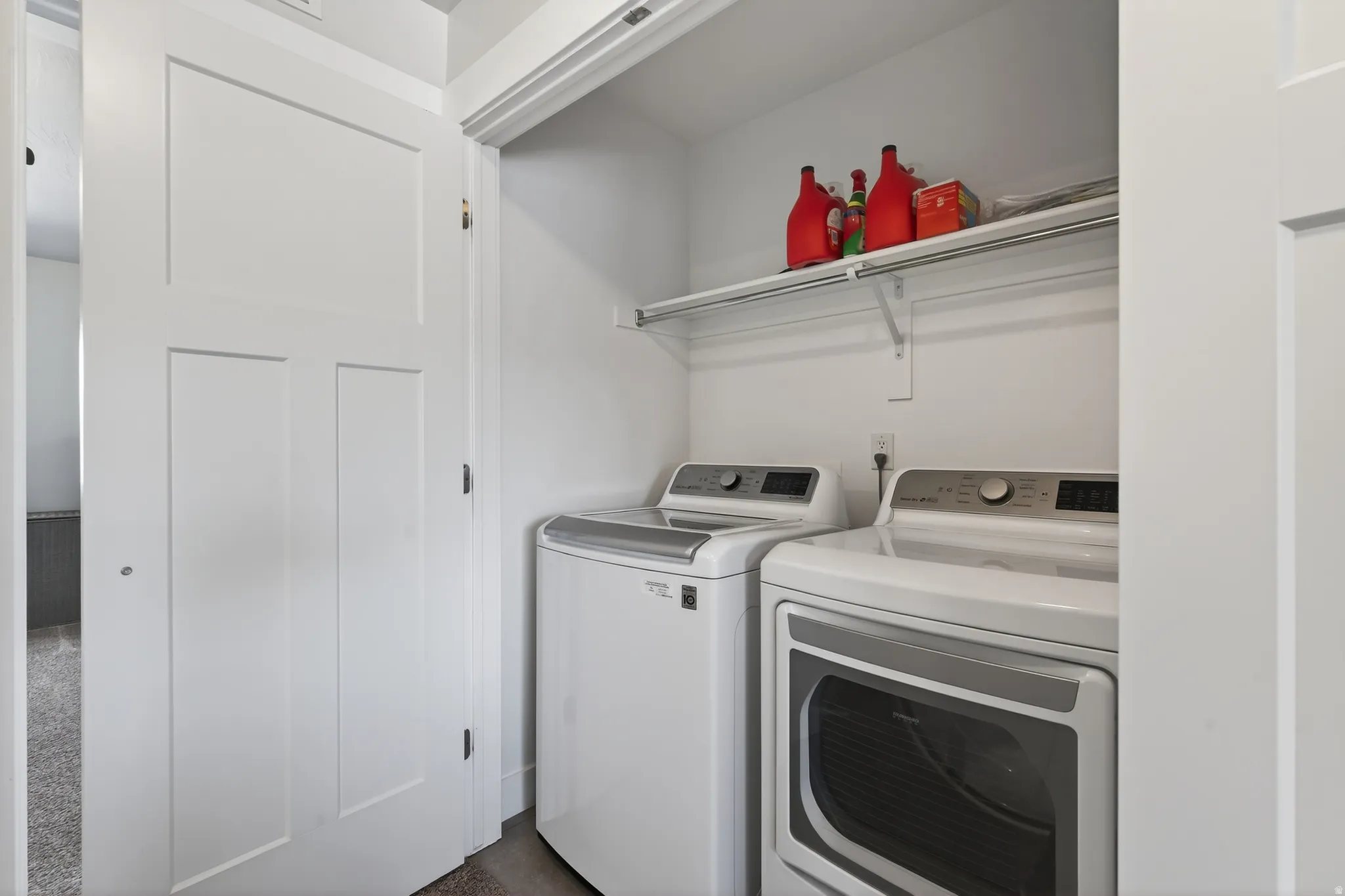 Laundry area with washer and clothes dryer