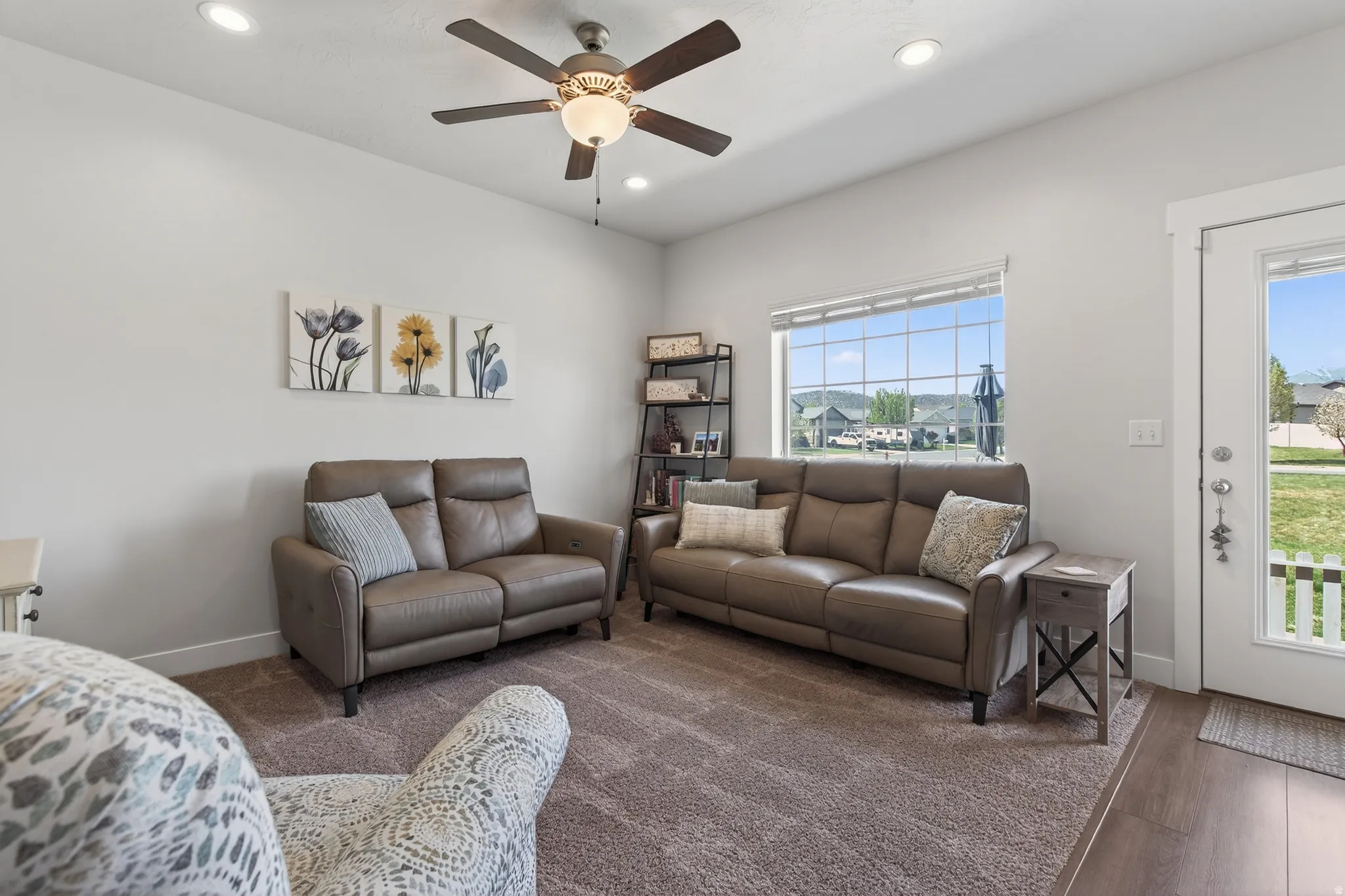 Living area with ceiling fan and recessed lighting