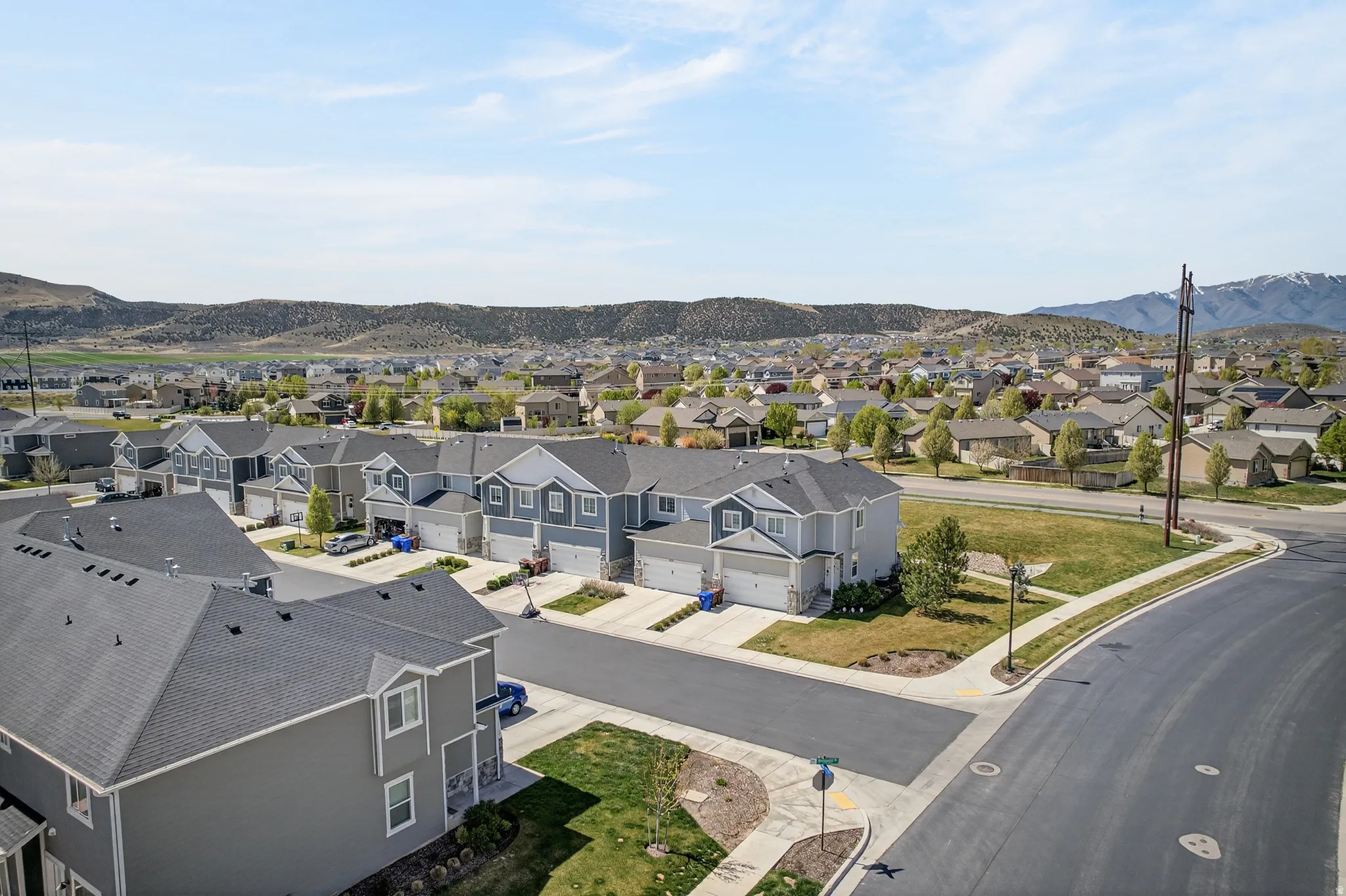 Aerial perspective of suburban area with a mountainous background
