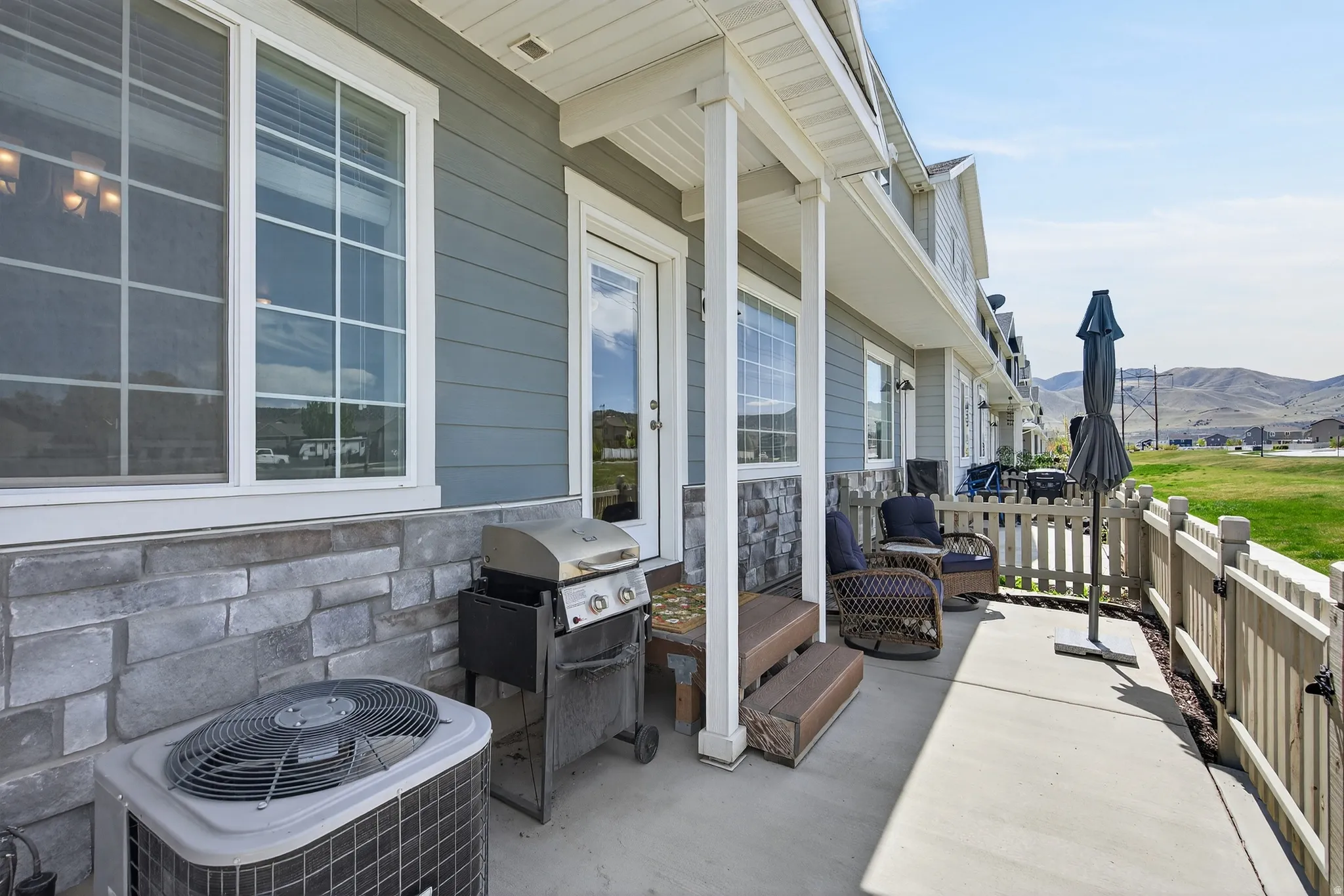 View of patio with a mountain view and grilling area