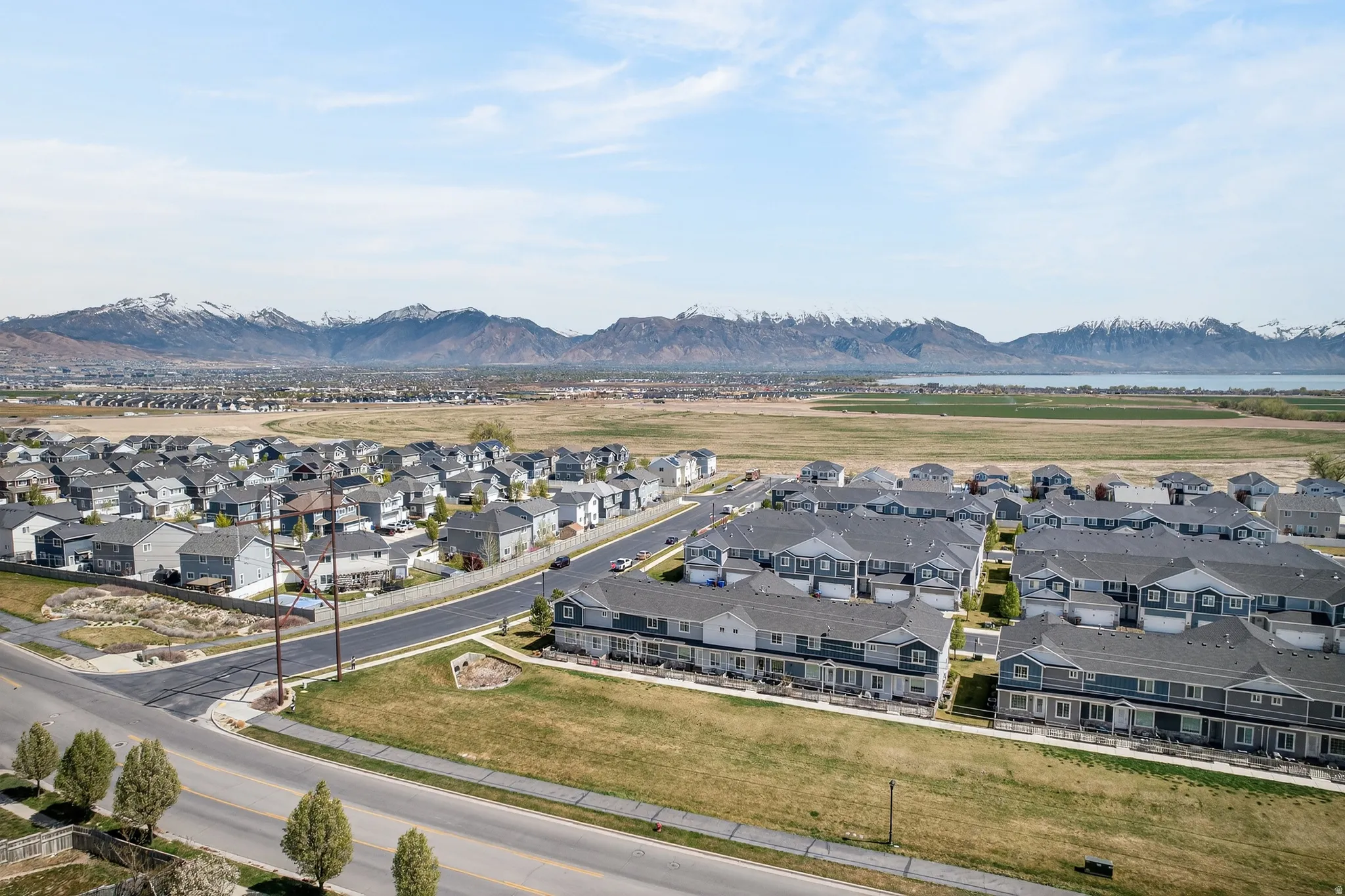 Aerial view of residential area featuring a mountain backdrop