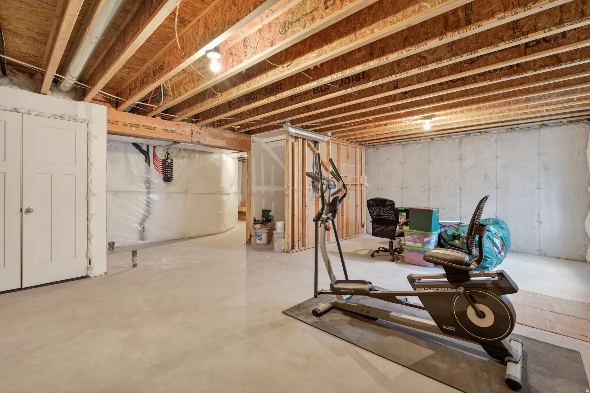 Exercise area featuring concrete floors