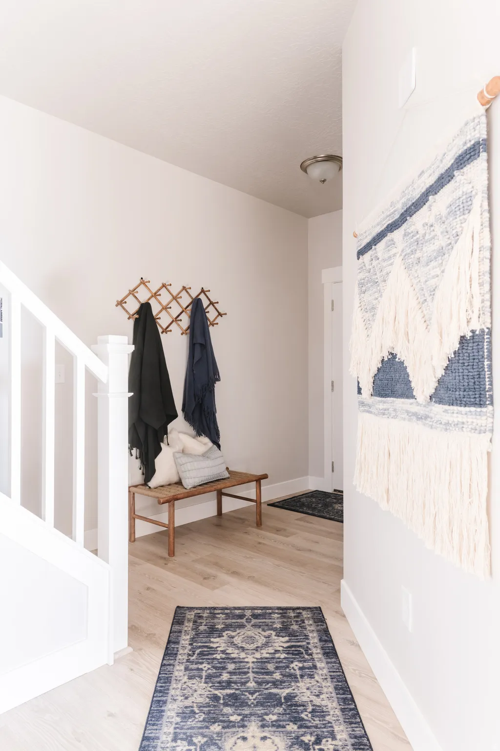 Entrance foyer featuring light wood-type flooring and baseboards