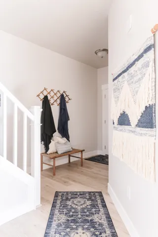 Entrance foyer featuring light wood-type flooring and baseboards