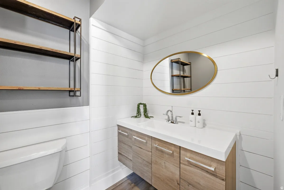 Half bath with vanity and toilet