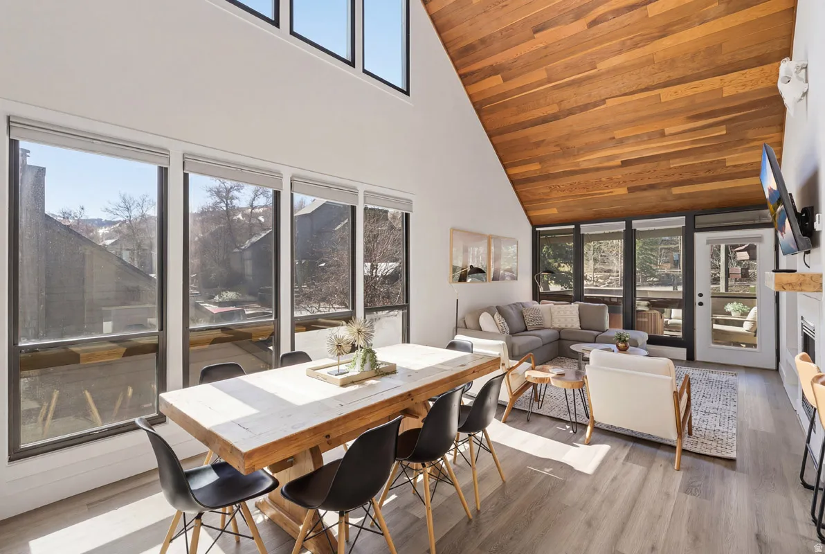 Dining room with wood finished floors and a vaulted wood ceiling