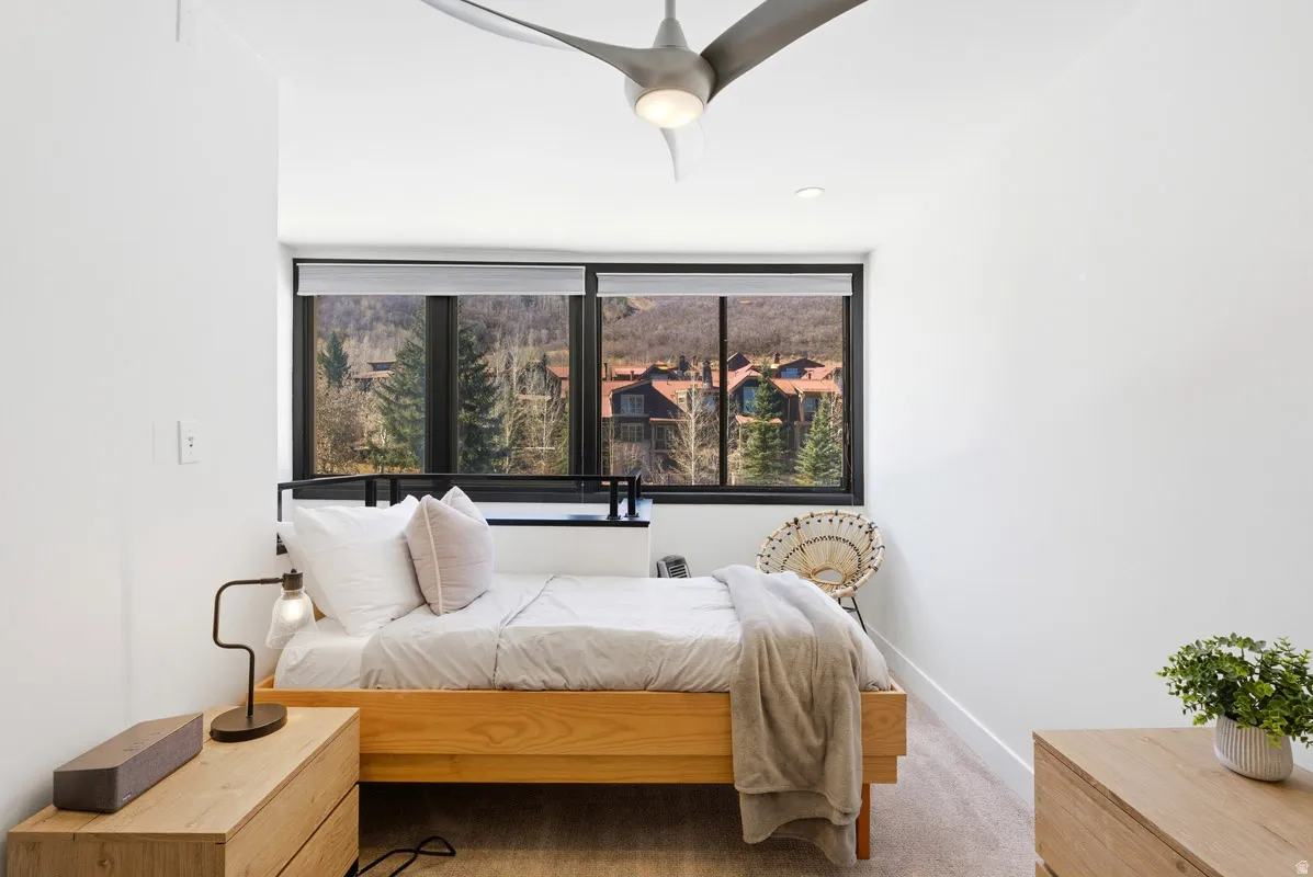 Carpeted bedroom with baseboards
