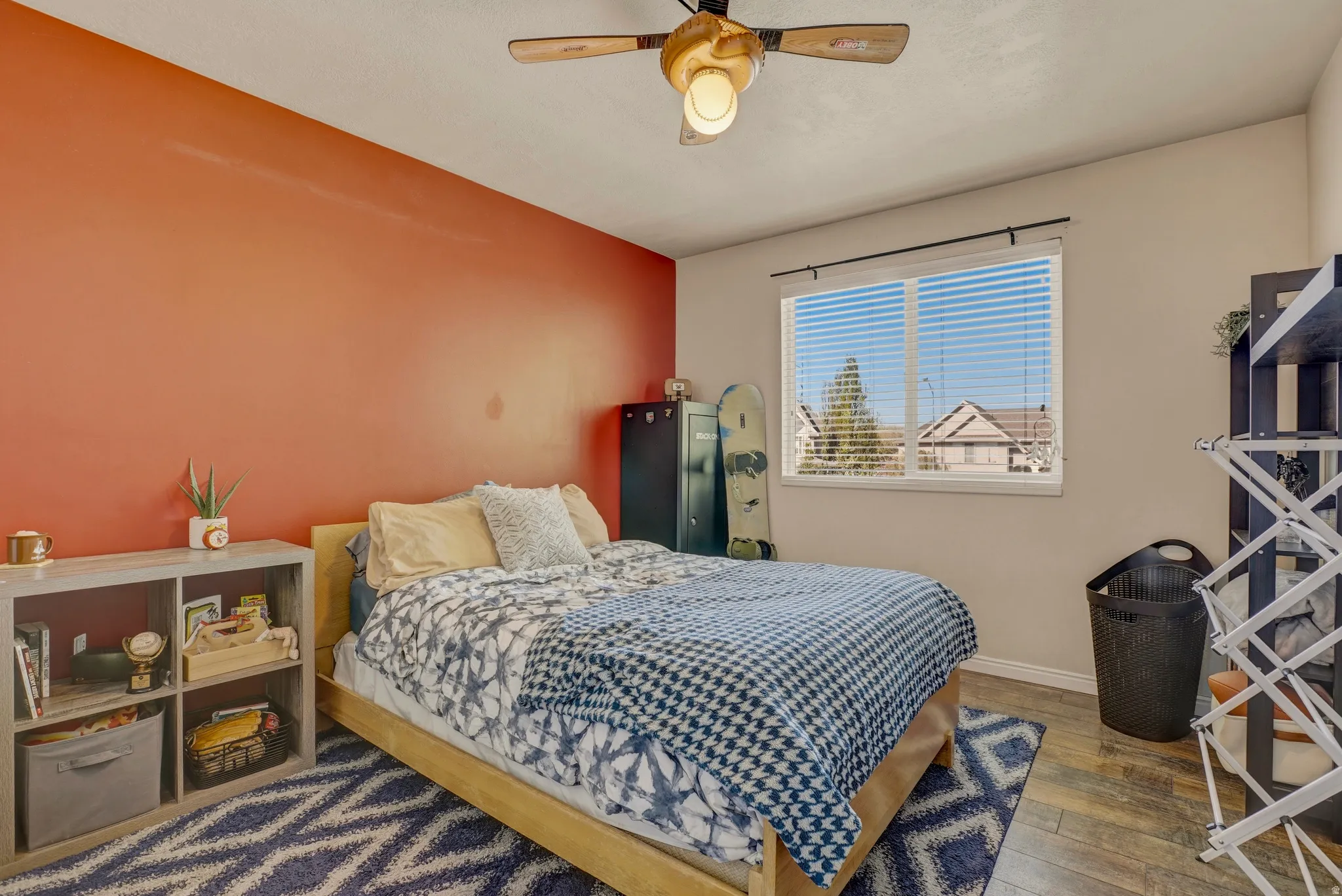Bedroom featuring hardwood / wood-style flooring and a ceiling fan