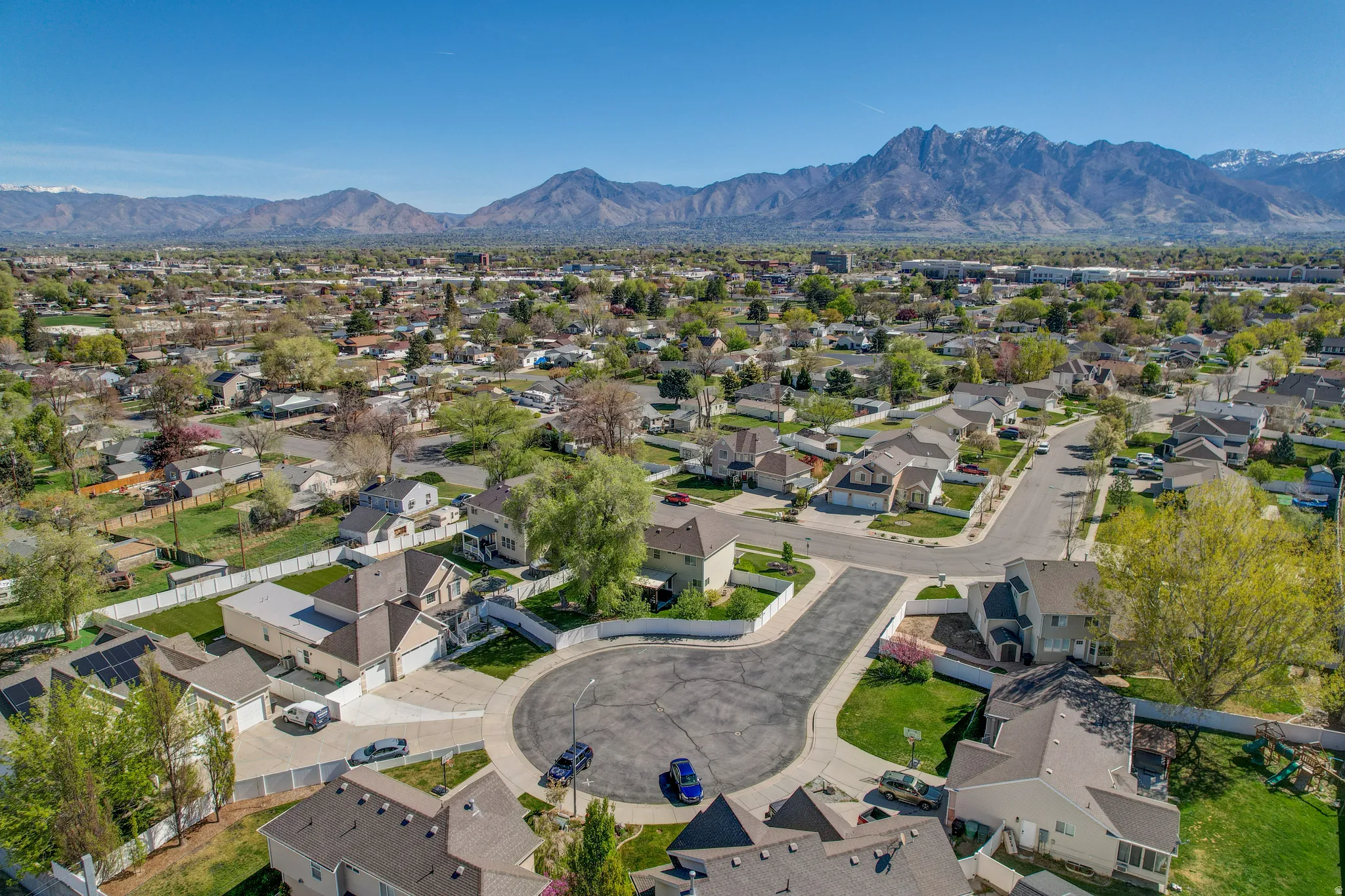 Aerial view of residential area featuring a mountainous background