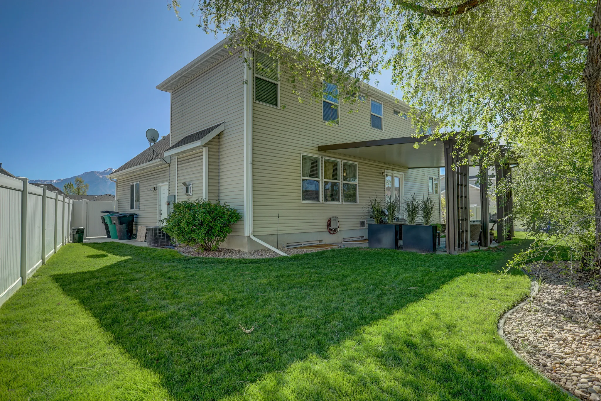 Back of property featuring a fenced backyard
