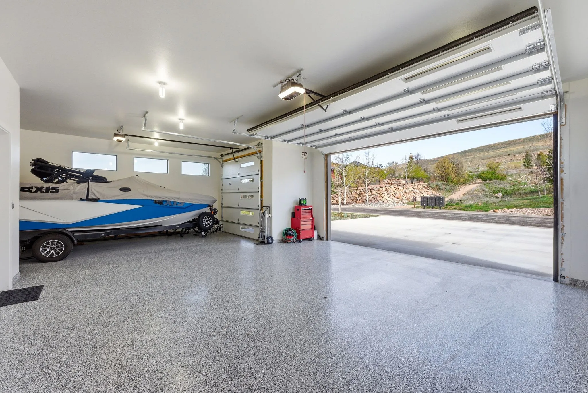 Garage featuring a garage door opener